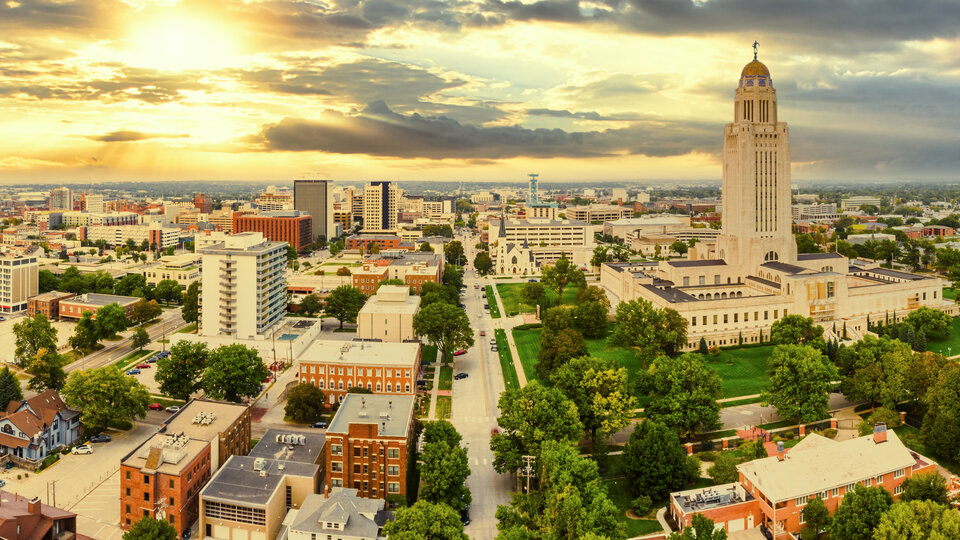 Landscape of Lincoln, Nebraska, featuring the tall, domed, capitol building.