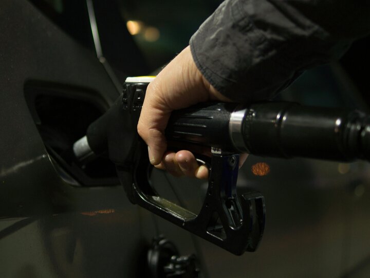 Hand holding gas pump